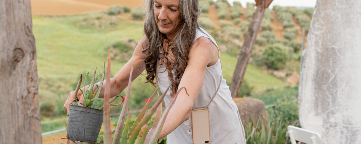 Lady desert gardening with aloe