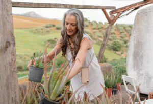 Lady desert gardening with aloe